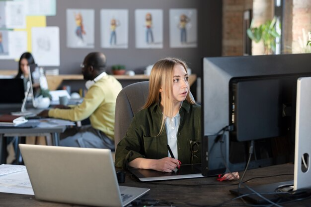 Young woman using laptop at cafe